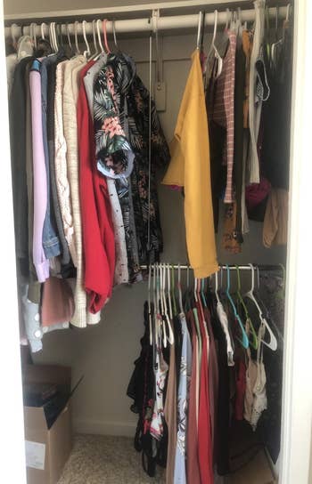 Reviewer photo using the closet rod to fit more clothes in their closet