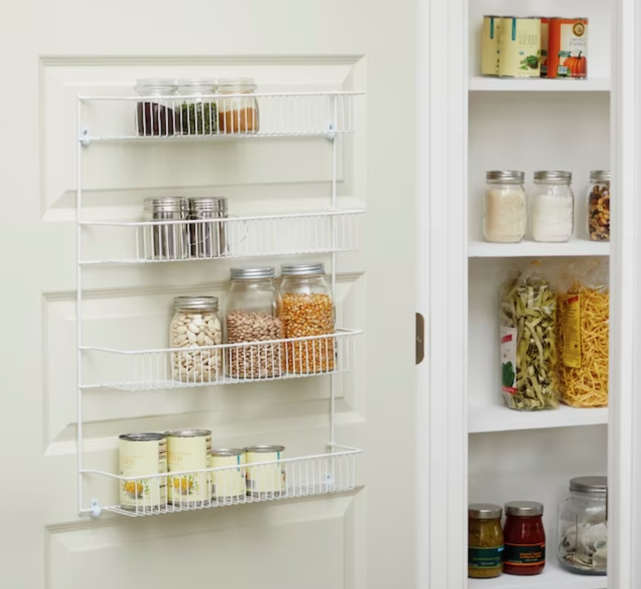 the white wire rack attached to the inside of a pantry door