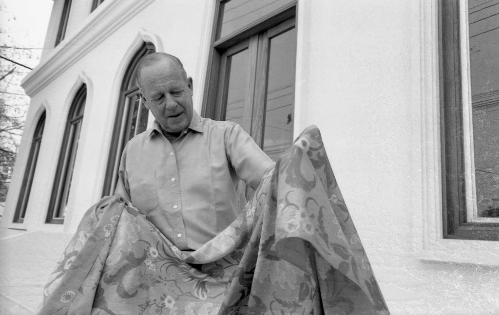 man holding a silk fabric