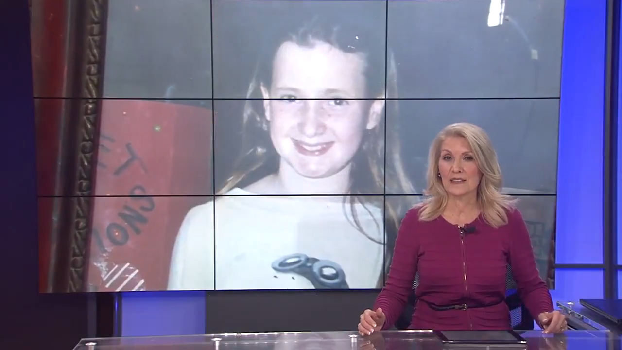 news reporter with the image of the girl on a screen behind her