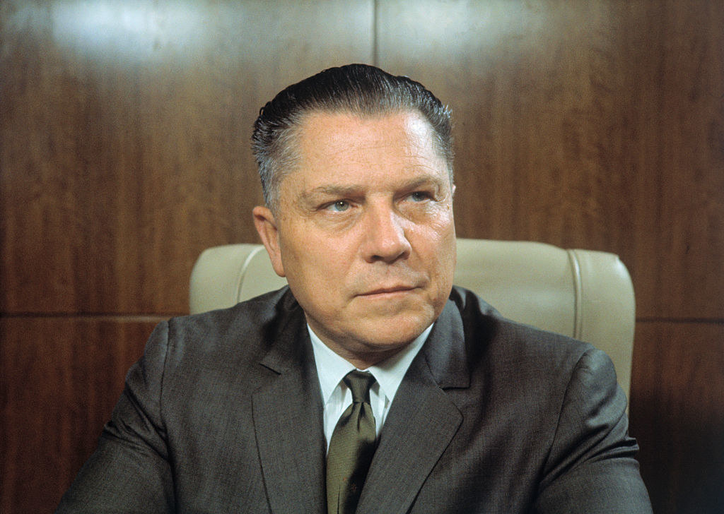 closeup of him sitting in a chair