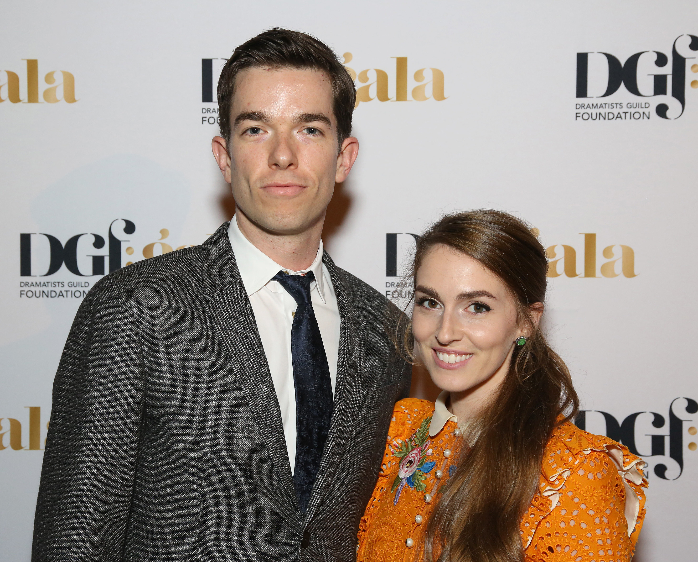 Close-up of John and Anna at a media event