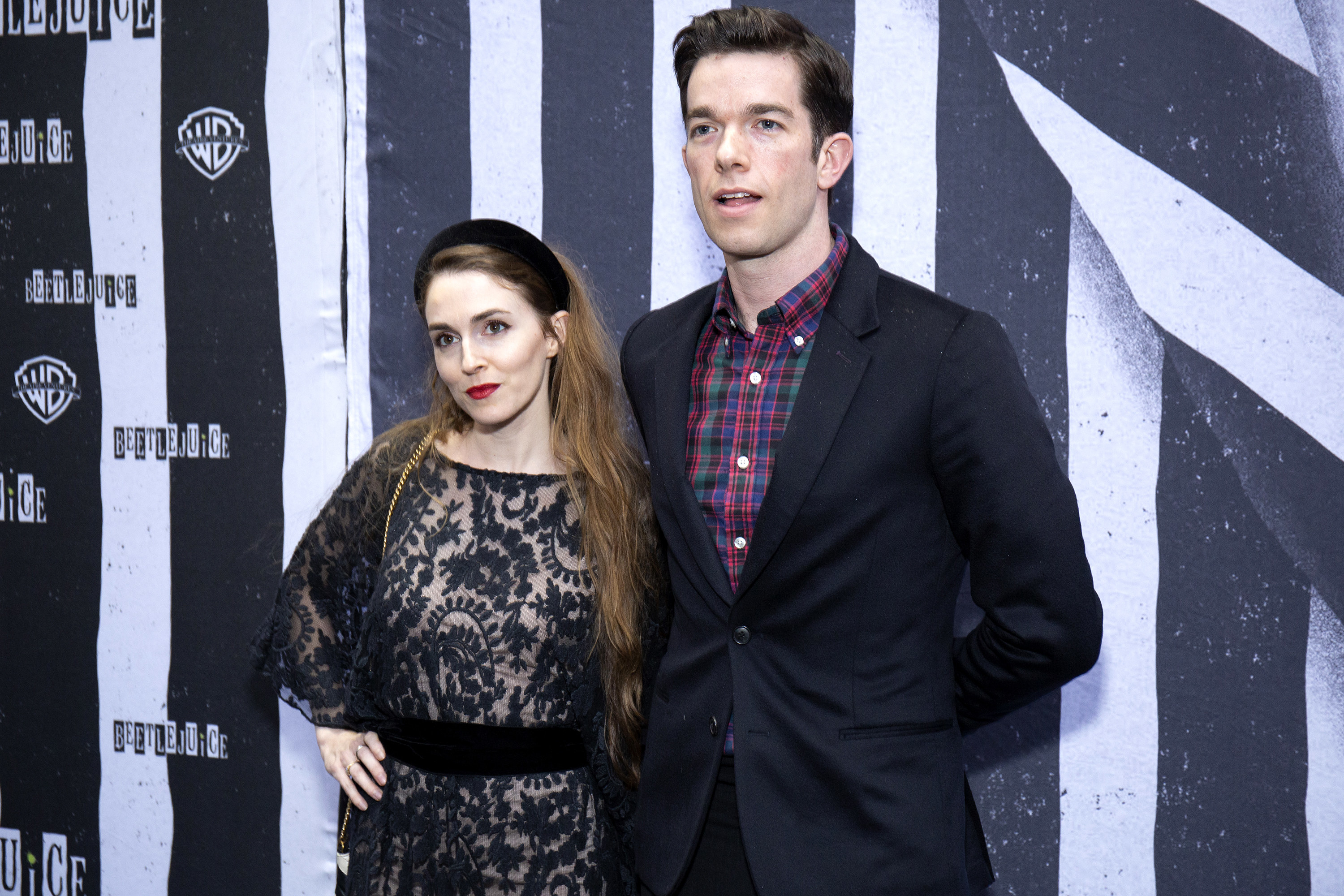 Close-up of John and Anna at a media event