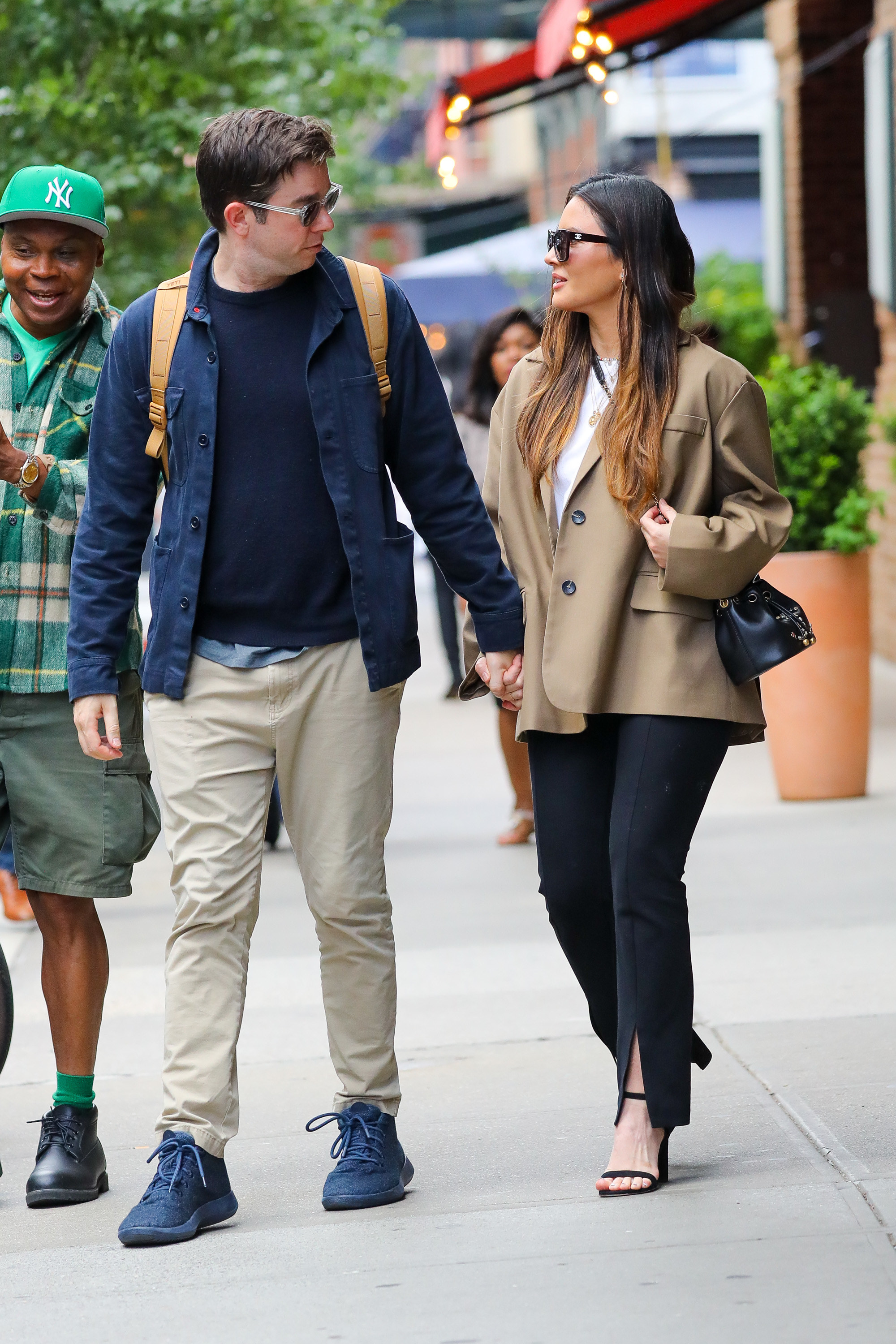 John and Olivia walking hand in hand