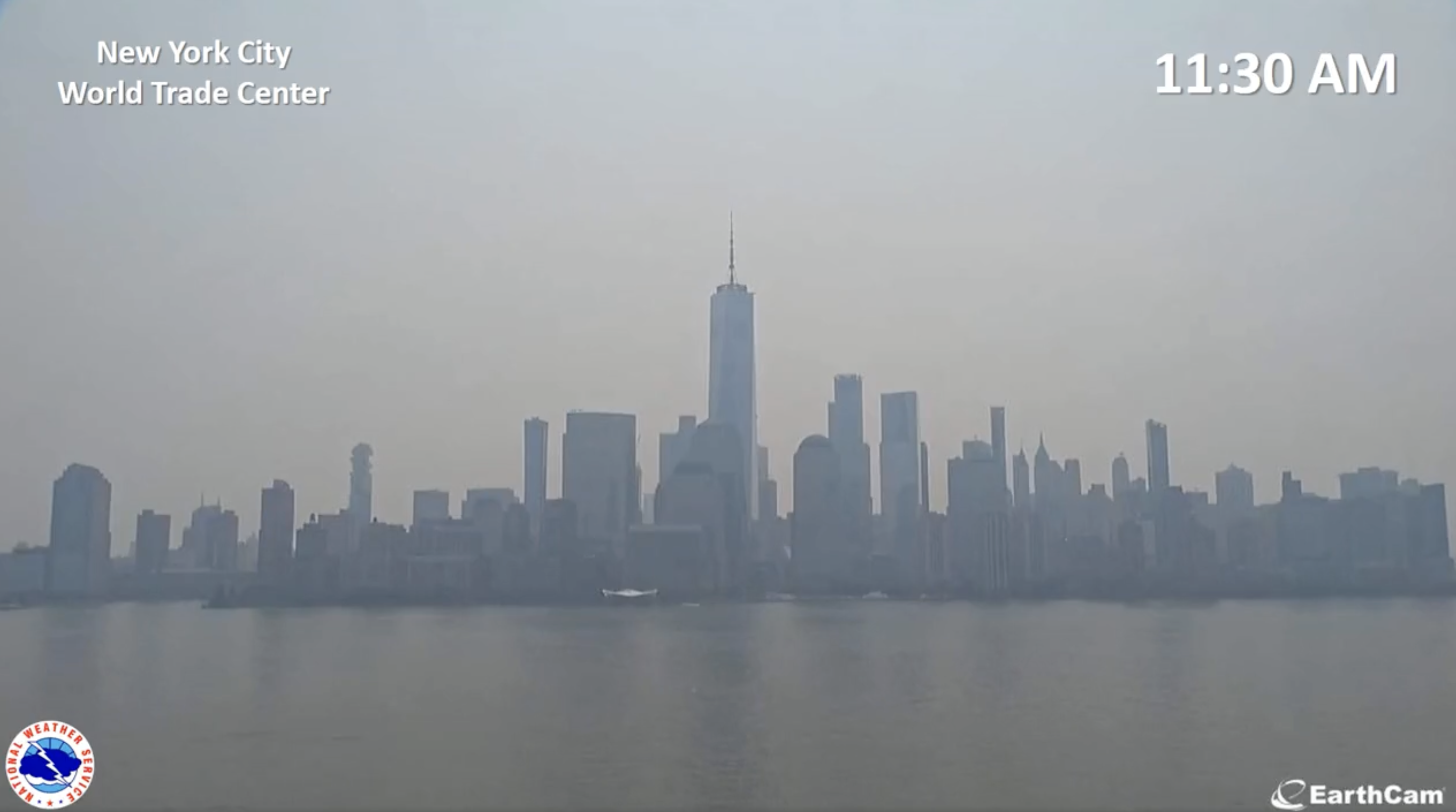 View of the downtown Manhattan skyline at 11:30 am, with the sky foggy