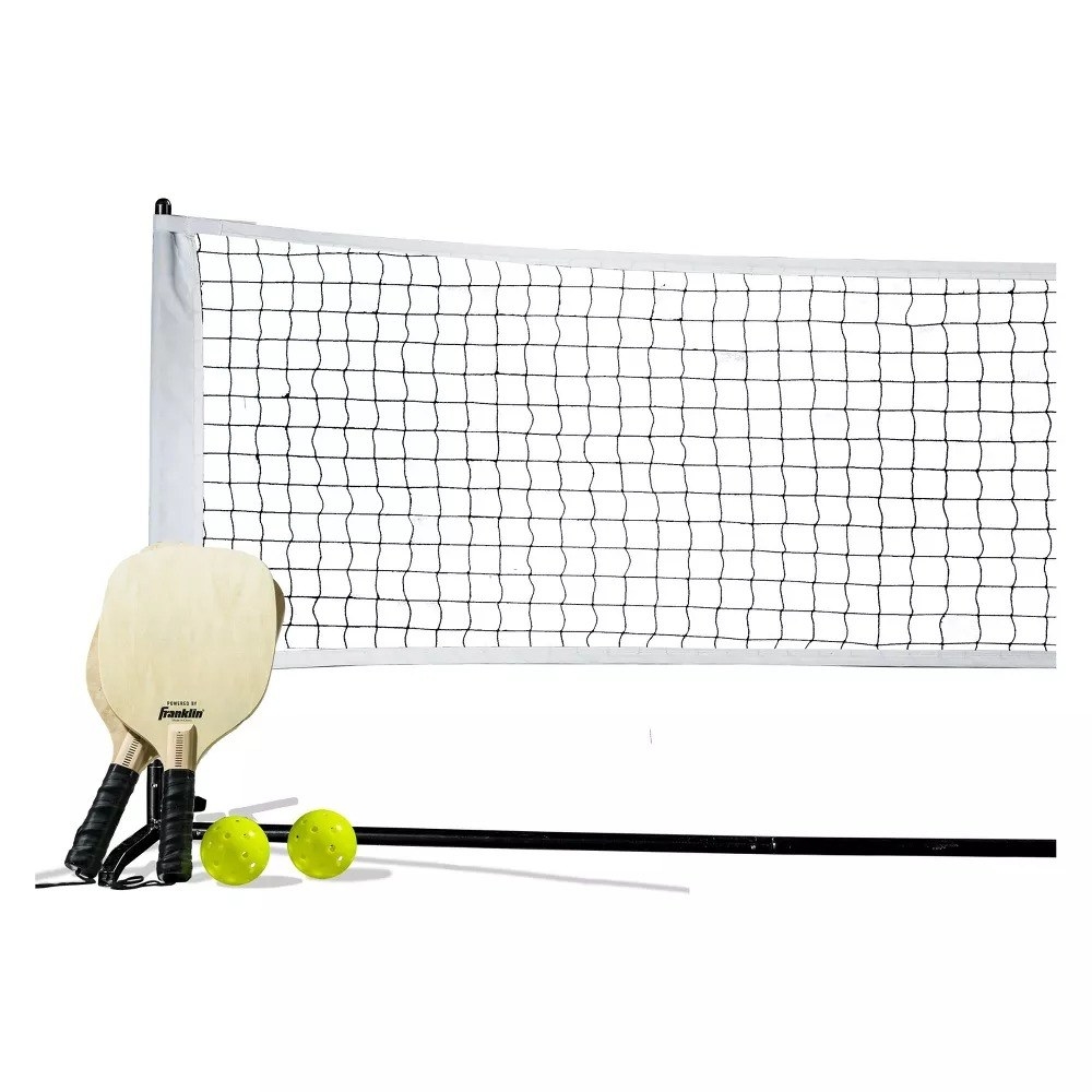Two pickleball paddles, two yellow balls, and a net against a white background