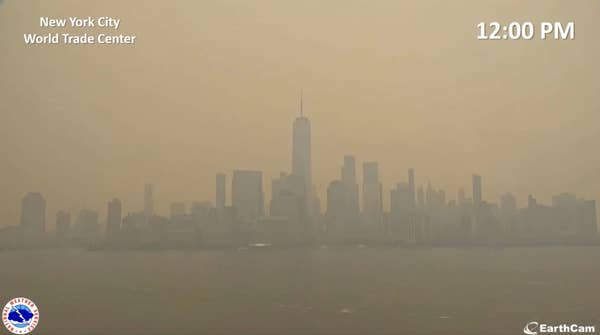 View of
                                                          the downtown
                                                          Manhattan
                                                          skyline at 12
                                                          pm, with the
                                                          sky now a
                                                          light orange