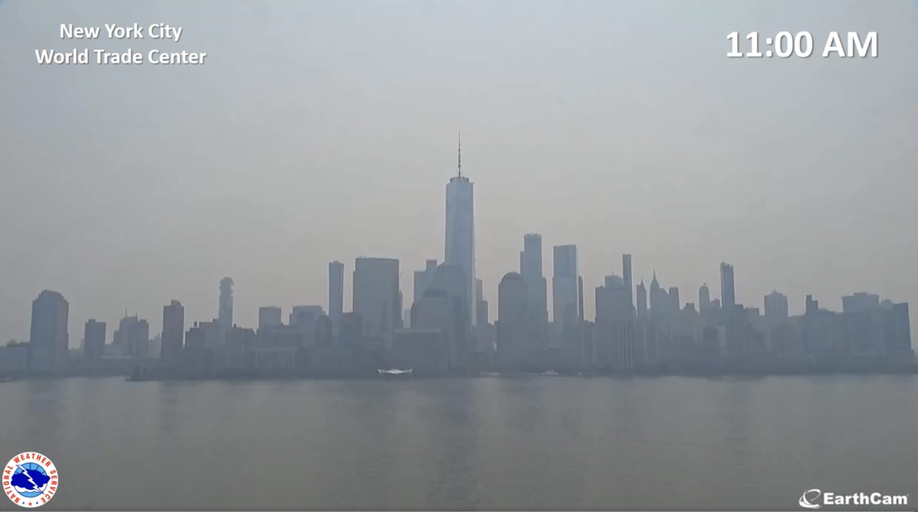 View of the downtown Manhattan skyline at 11 am, with the sky foggy