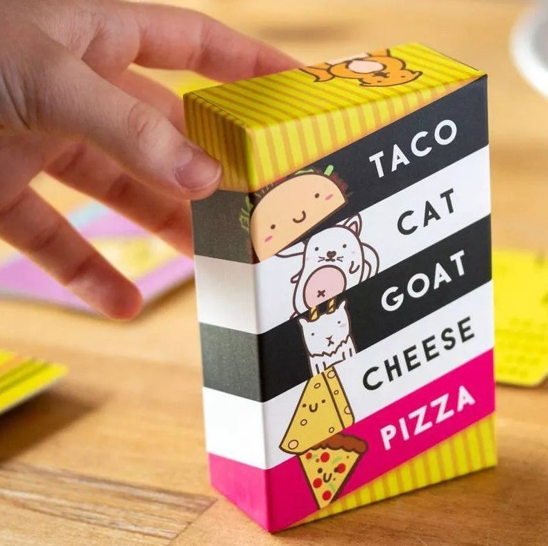 A model reaching for the card deck