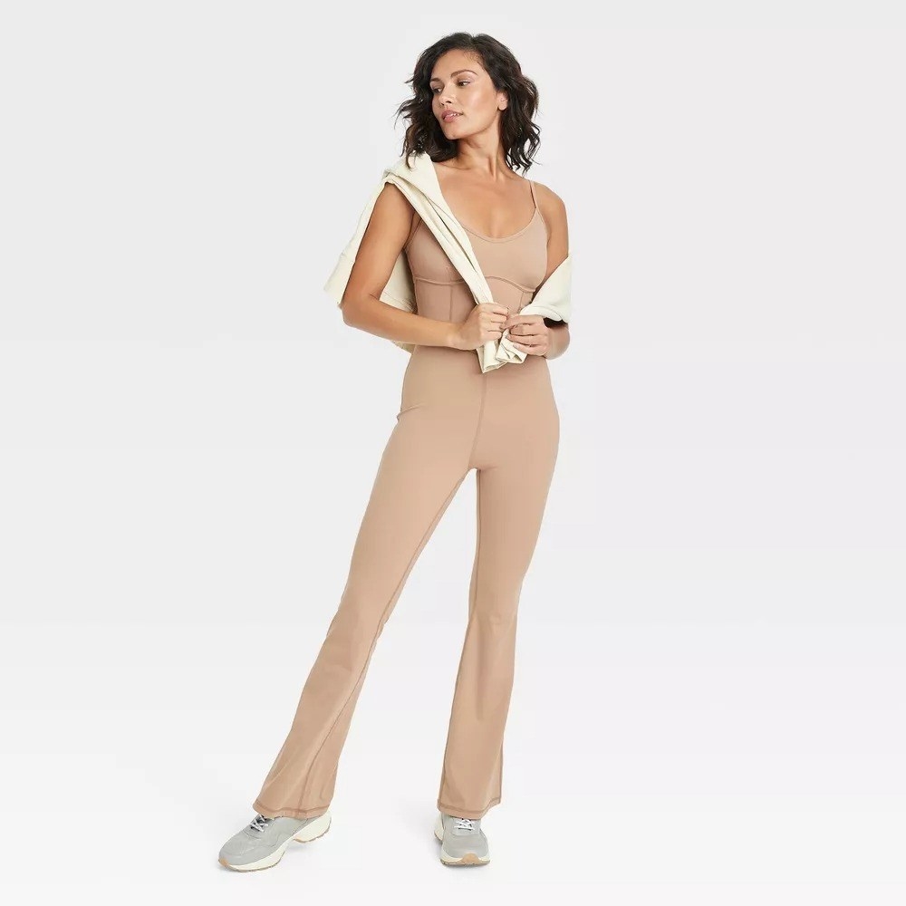 A model with the jumpsuit in beige
