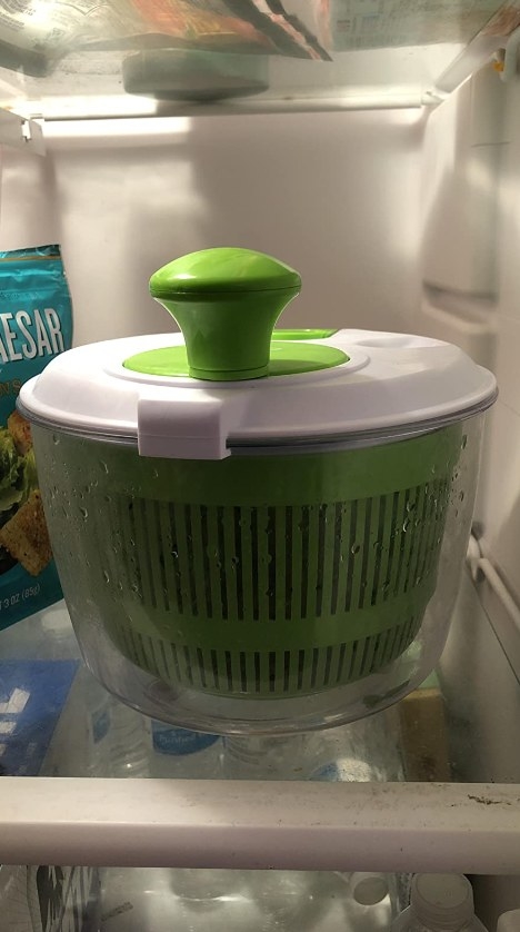 A reviewer&#x27;s photo of the salad spinner in the fridge