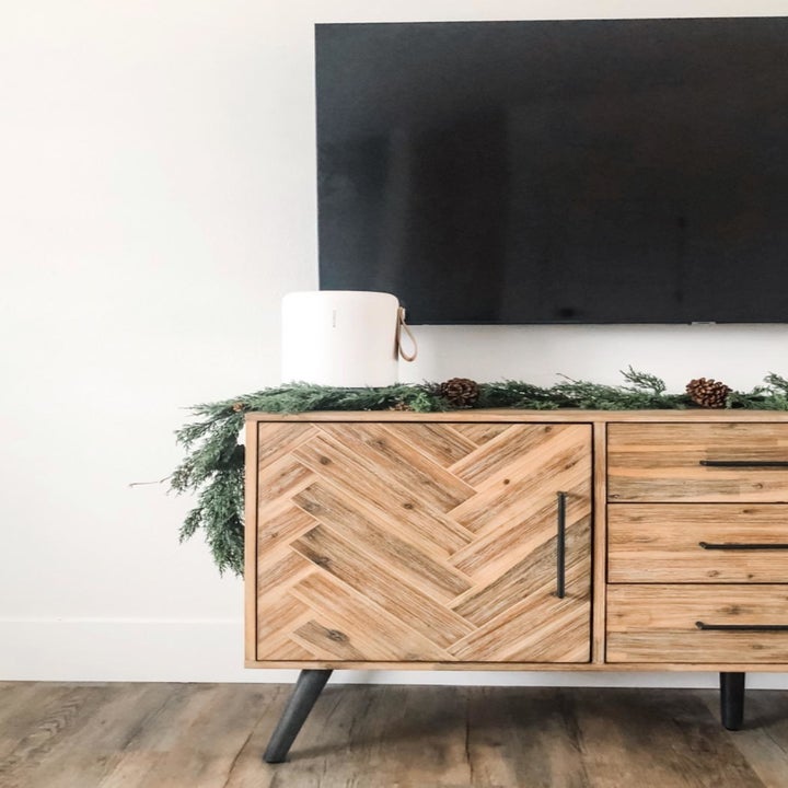 reviewers air purifier on a TV stand