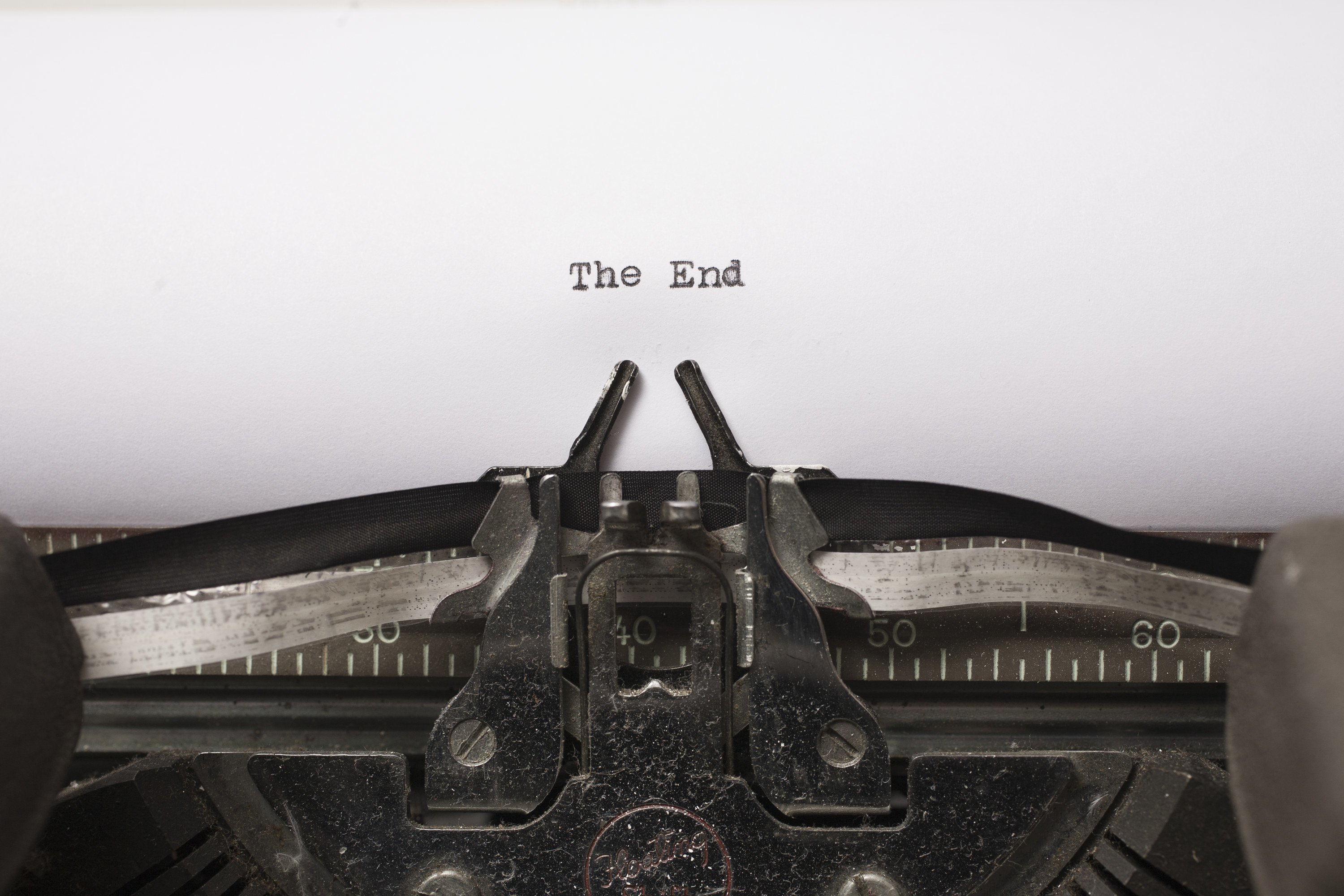 a typewriter types the words &quot;the end&quot;