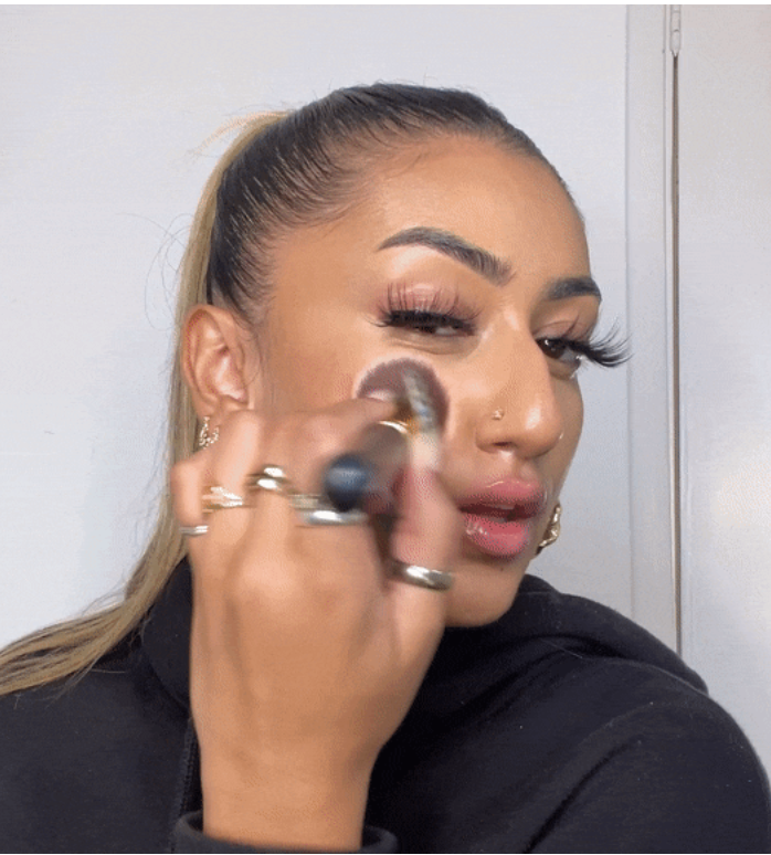 A makeup artist applying makeup