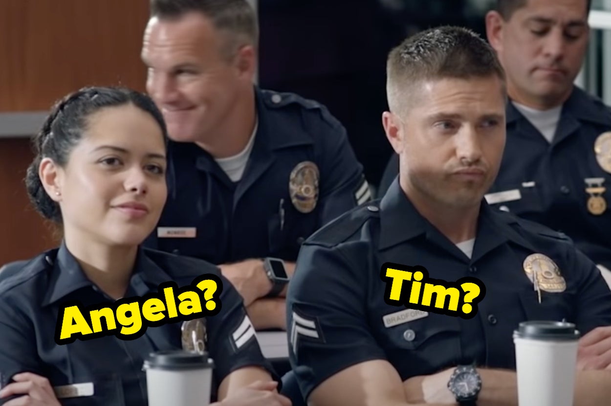 Two cops sitting with their arms crossed.