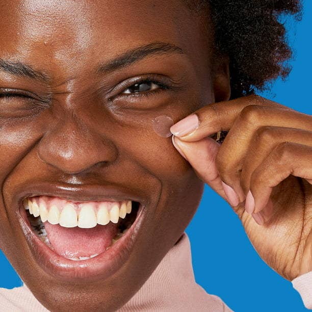 Model smiling while wearing product