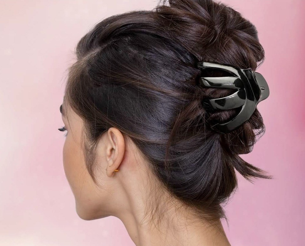 a model wearing the black claw clip