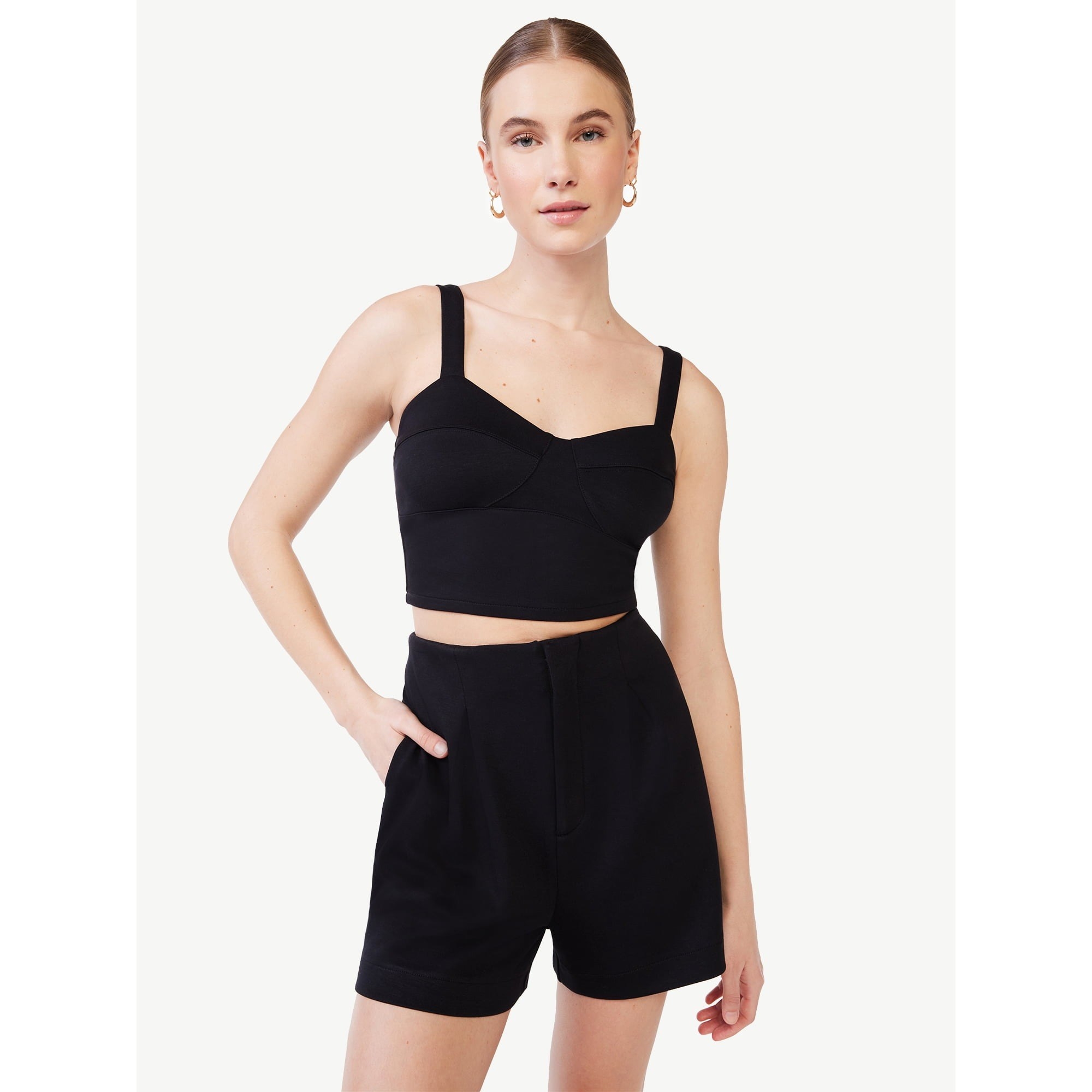 A model in the black tank with matching shorts