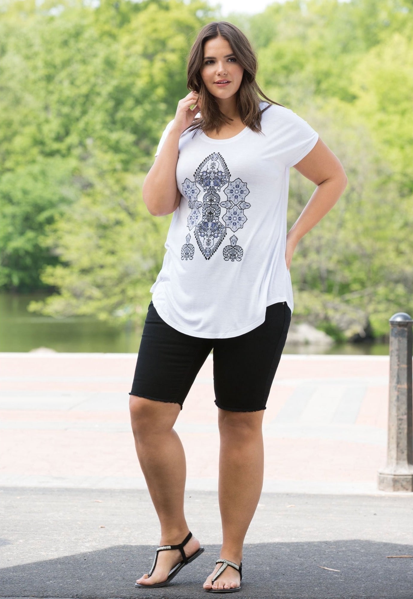 A model in the black above the knee shorts