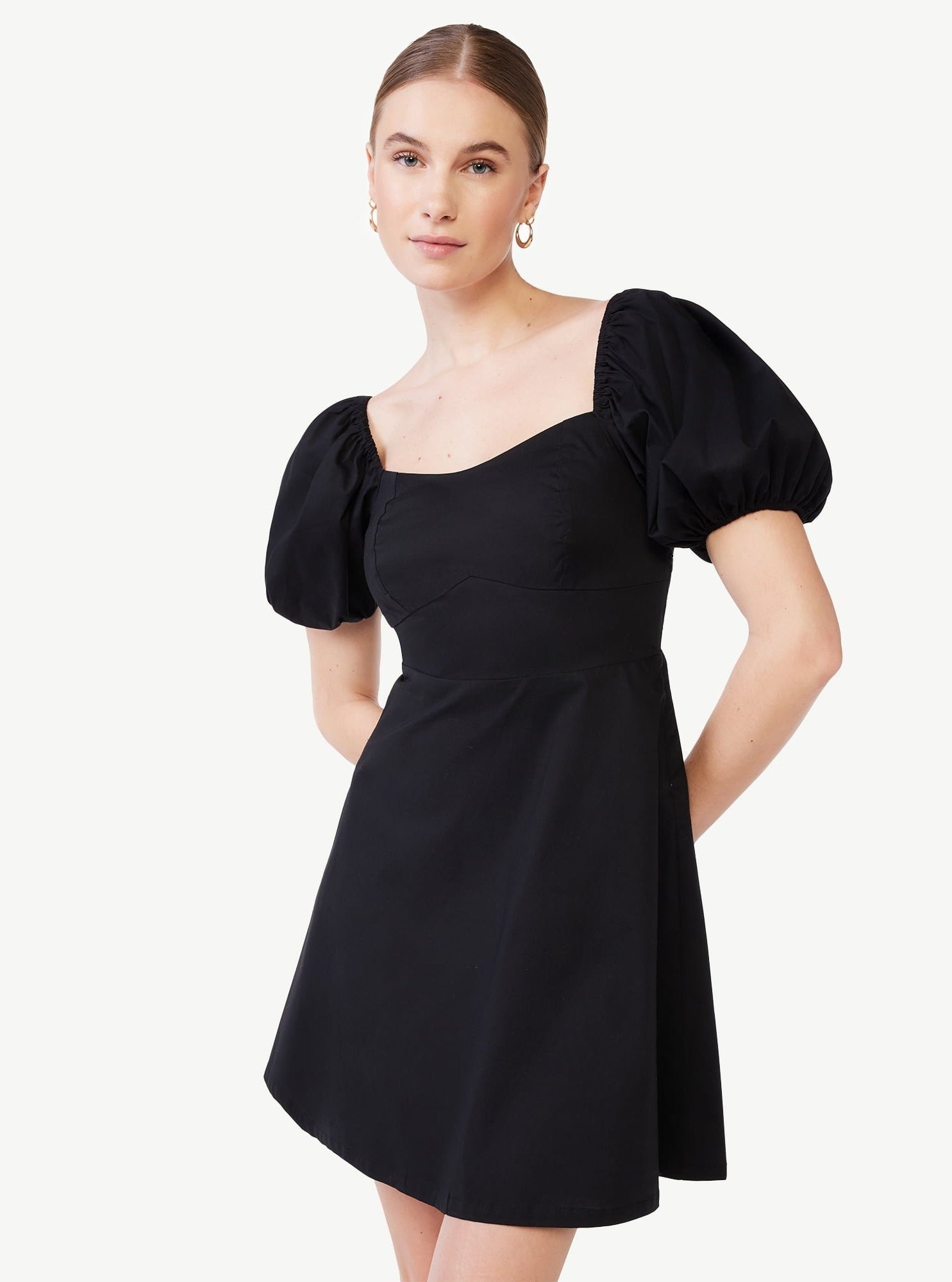 A model in the black dress with puff sleeve