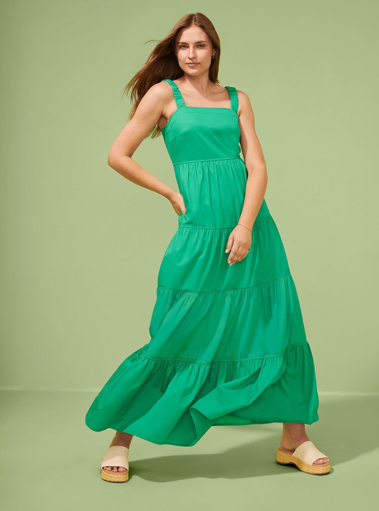 A model in the green maxi