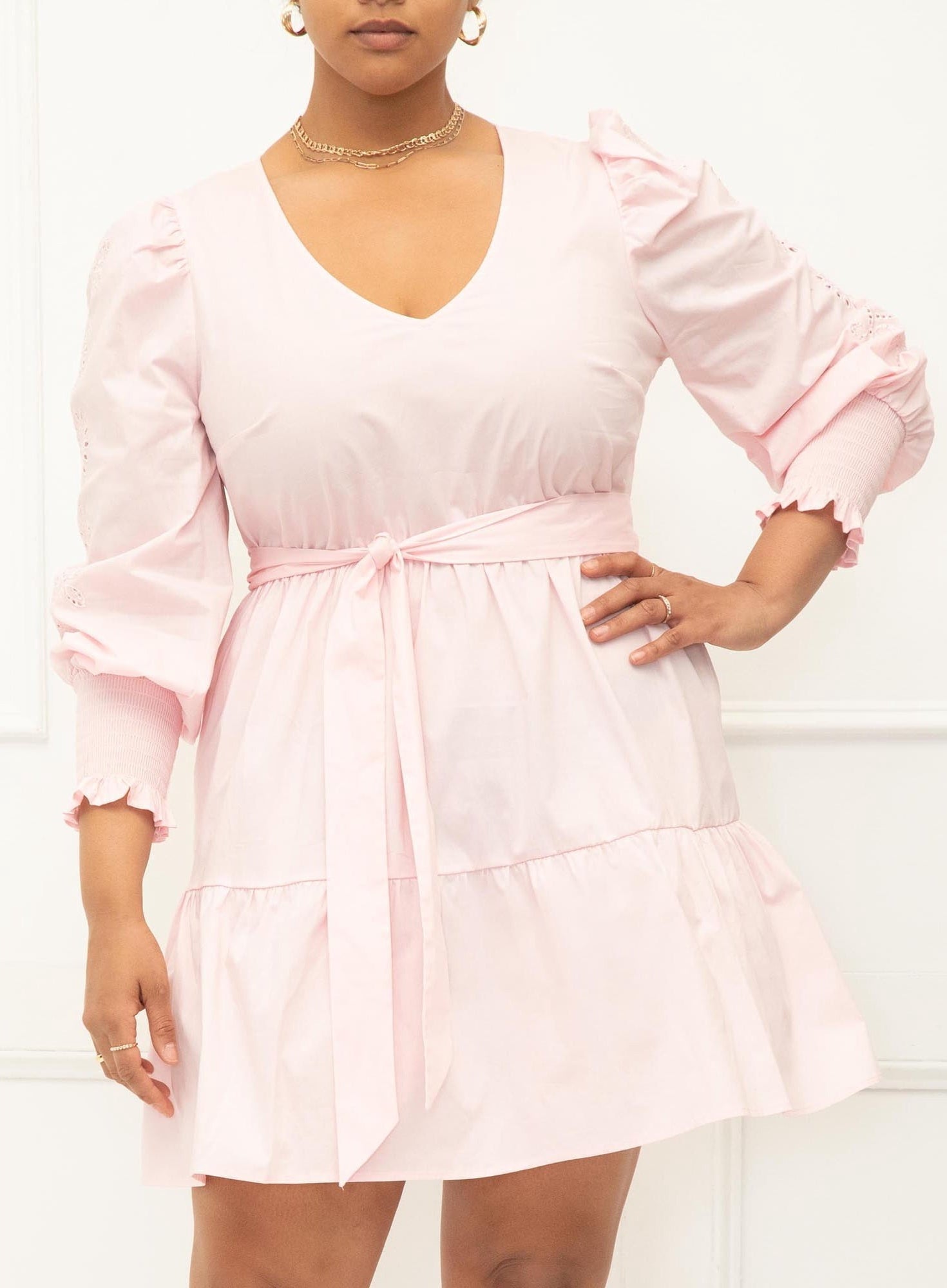 A model in the blush short dress