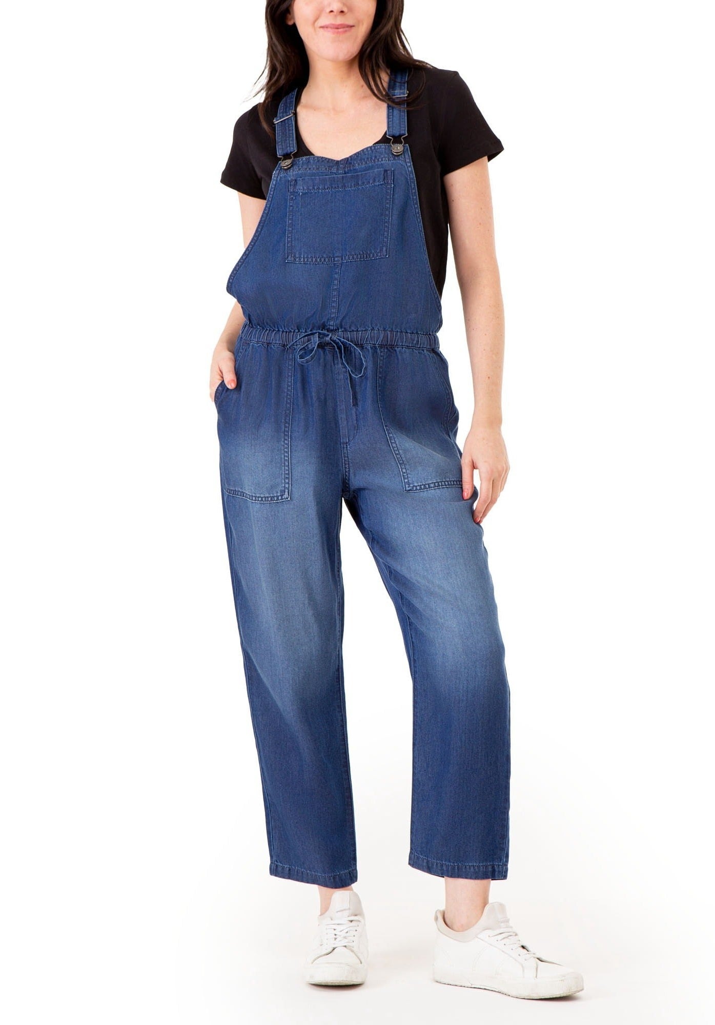 A model in the dark wash overalls