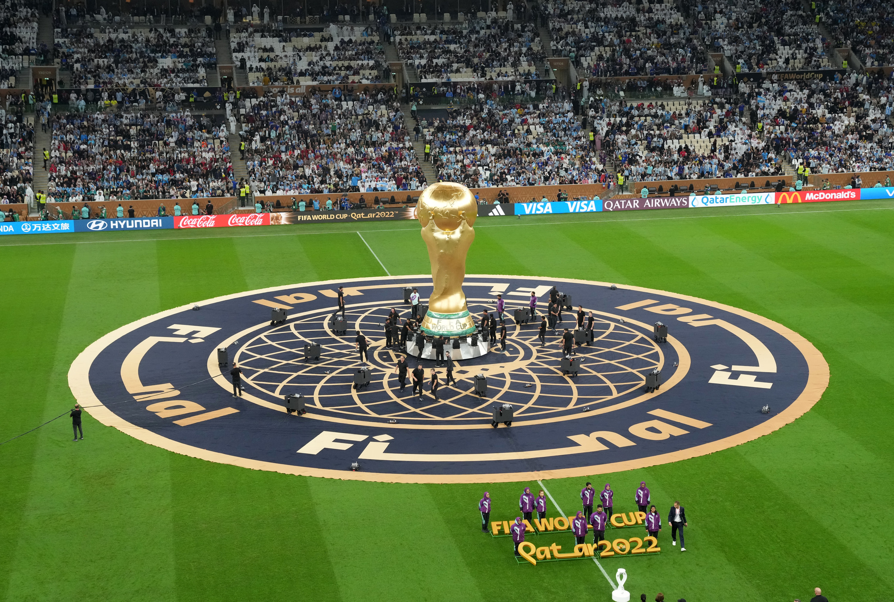 A giant Jules Rimet Trophy on the pitch prior to the FIFA World Cup final at Lusail Stadium, Qatar