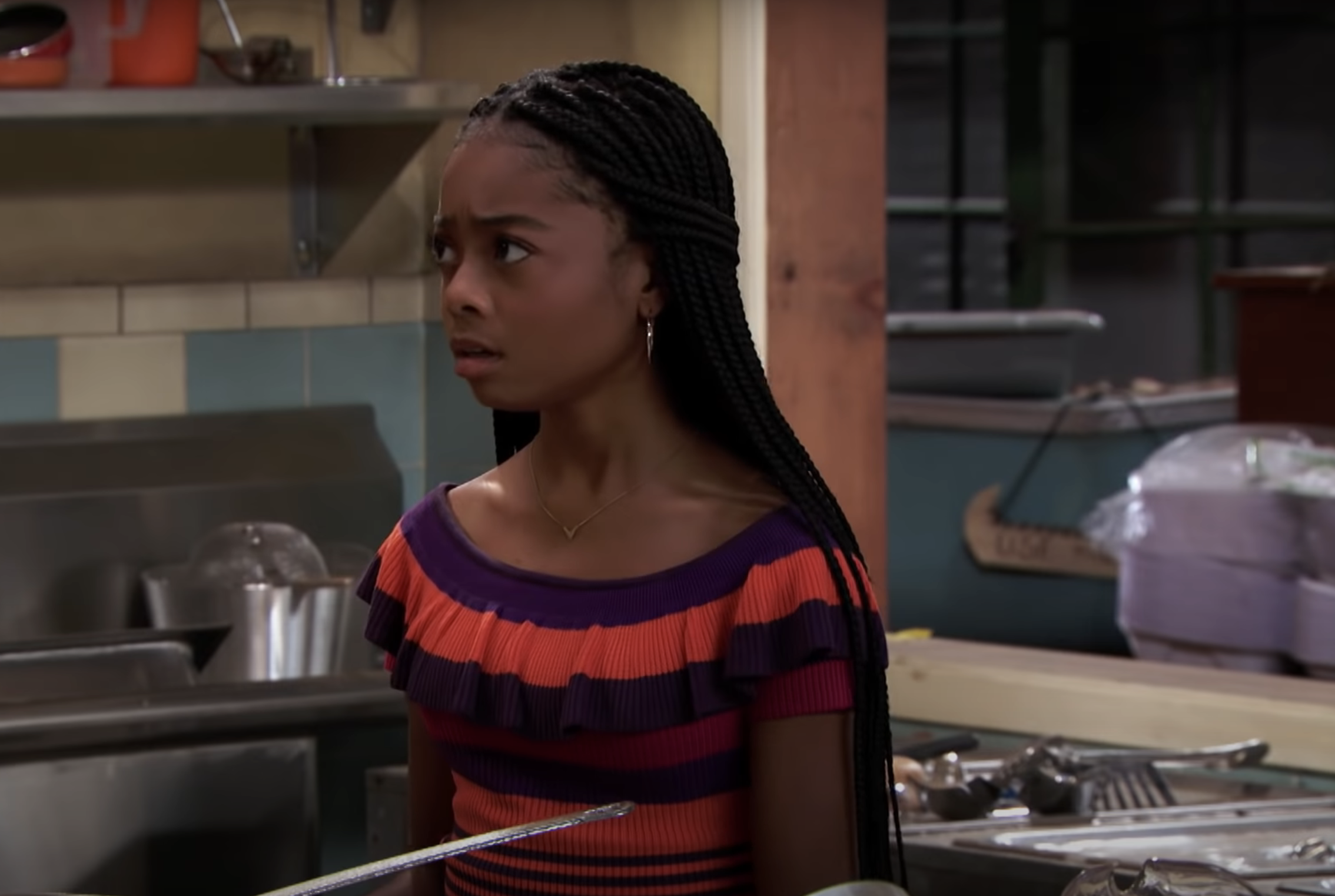 skai with long braids in the show