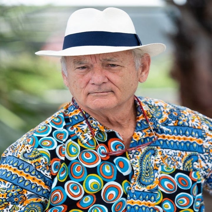 Close-up of Bill in a hat and colorful print shirt