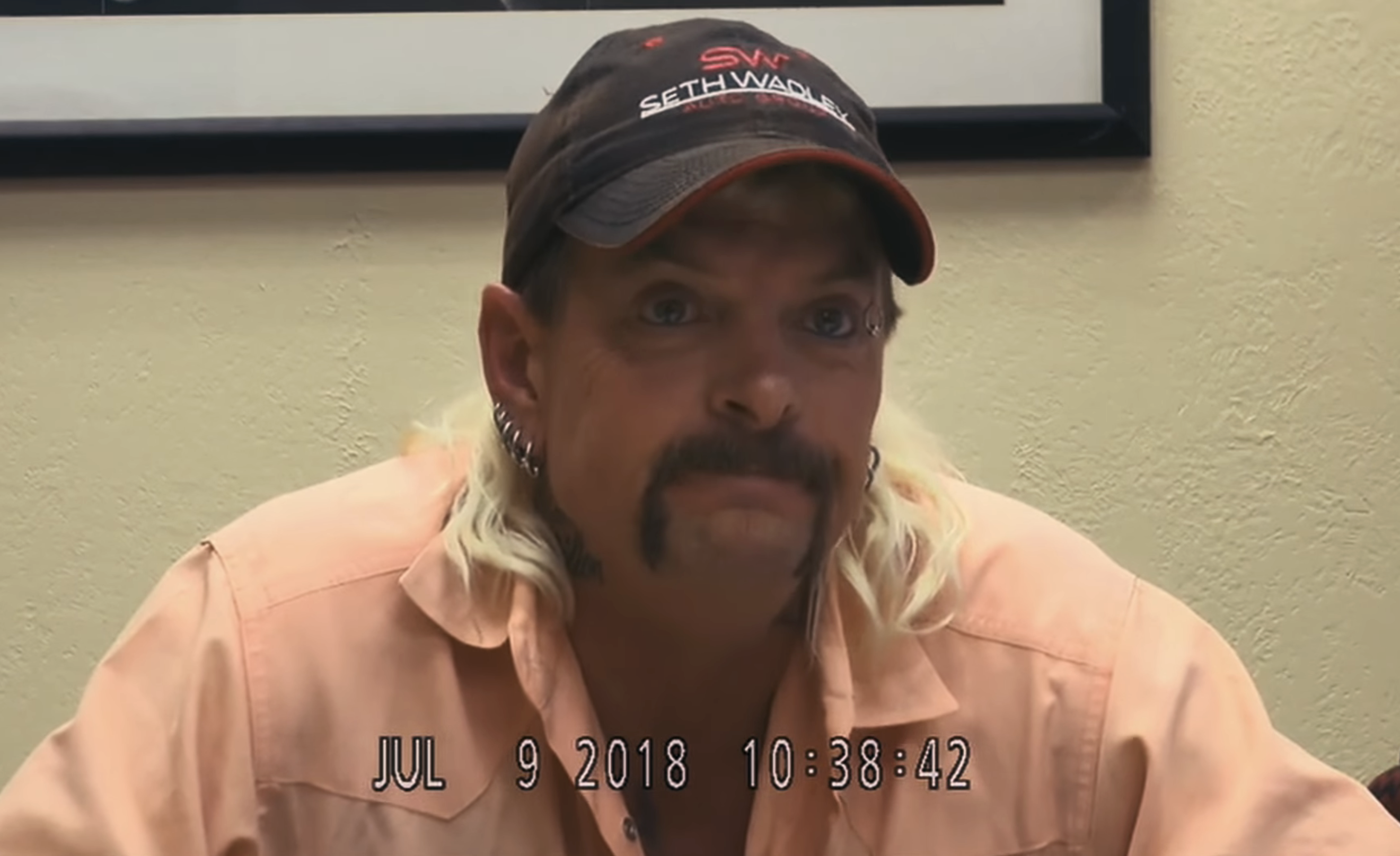 Close-up of Joe Exotic wearing a cap