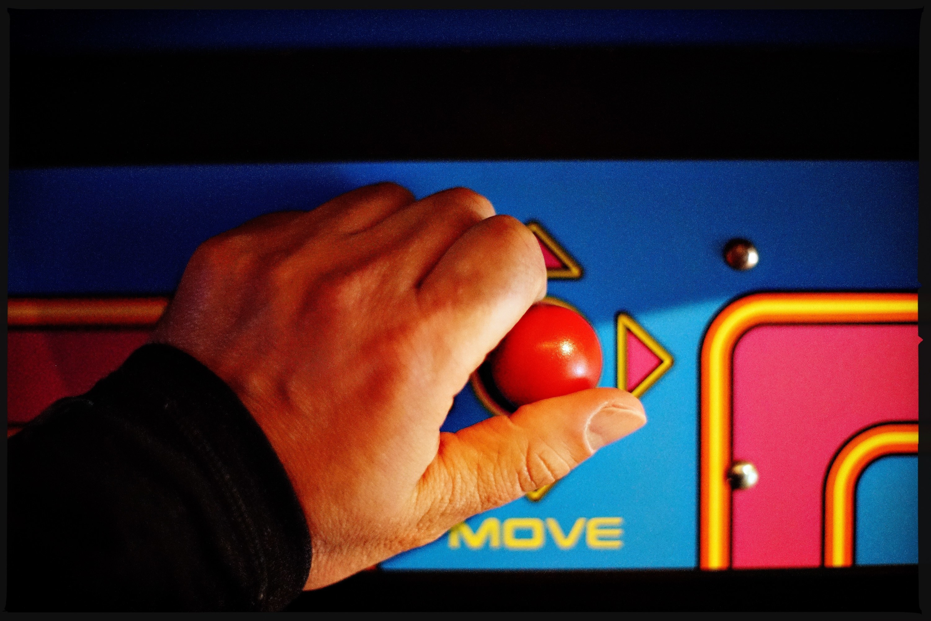 hand on an arcade joystick