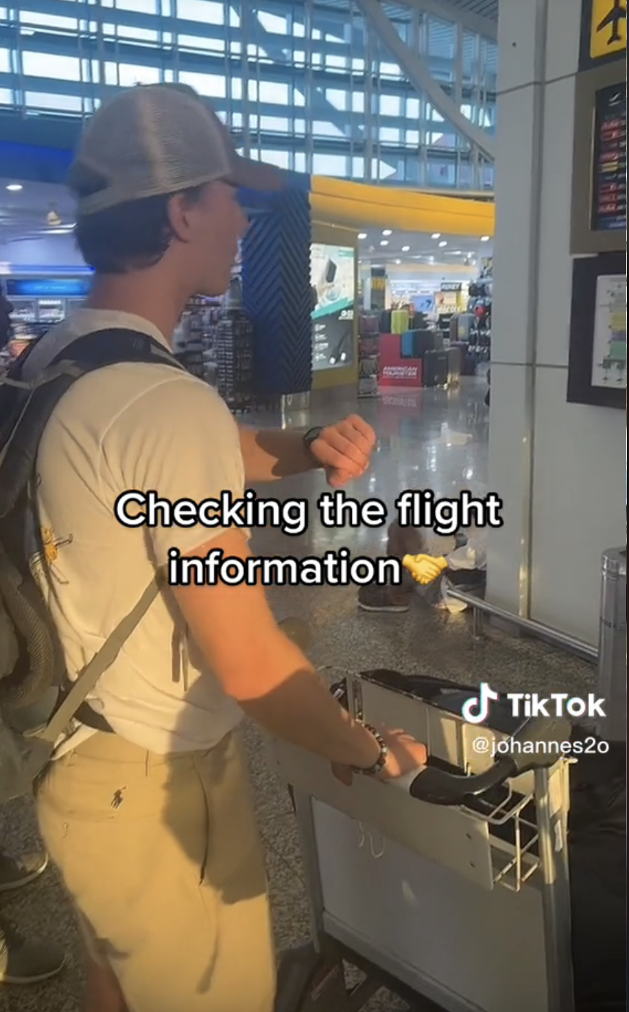 Screenshot of Airport Dad on TikTok with caption &quot;Checking the flight information&quot;