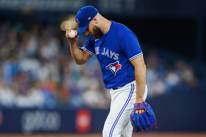 Anthony Bass #52 of the Toronto Blue Jays pitches in the ninth inning of their MLB game