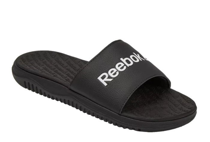 black slide sandals that say reebok in white