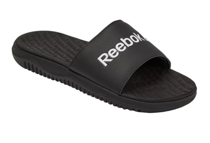black slide sandals that say reebok in white