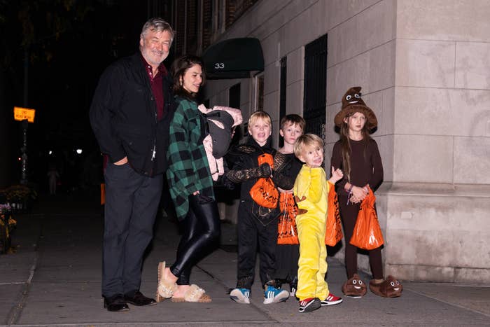 the family outside trick or treating