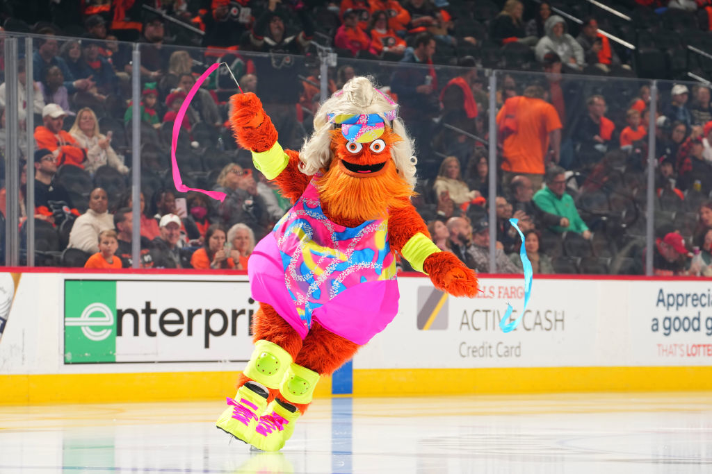 the mascot ice skating in barbie clothes