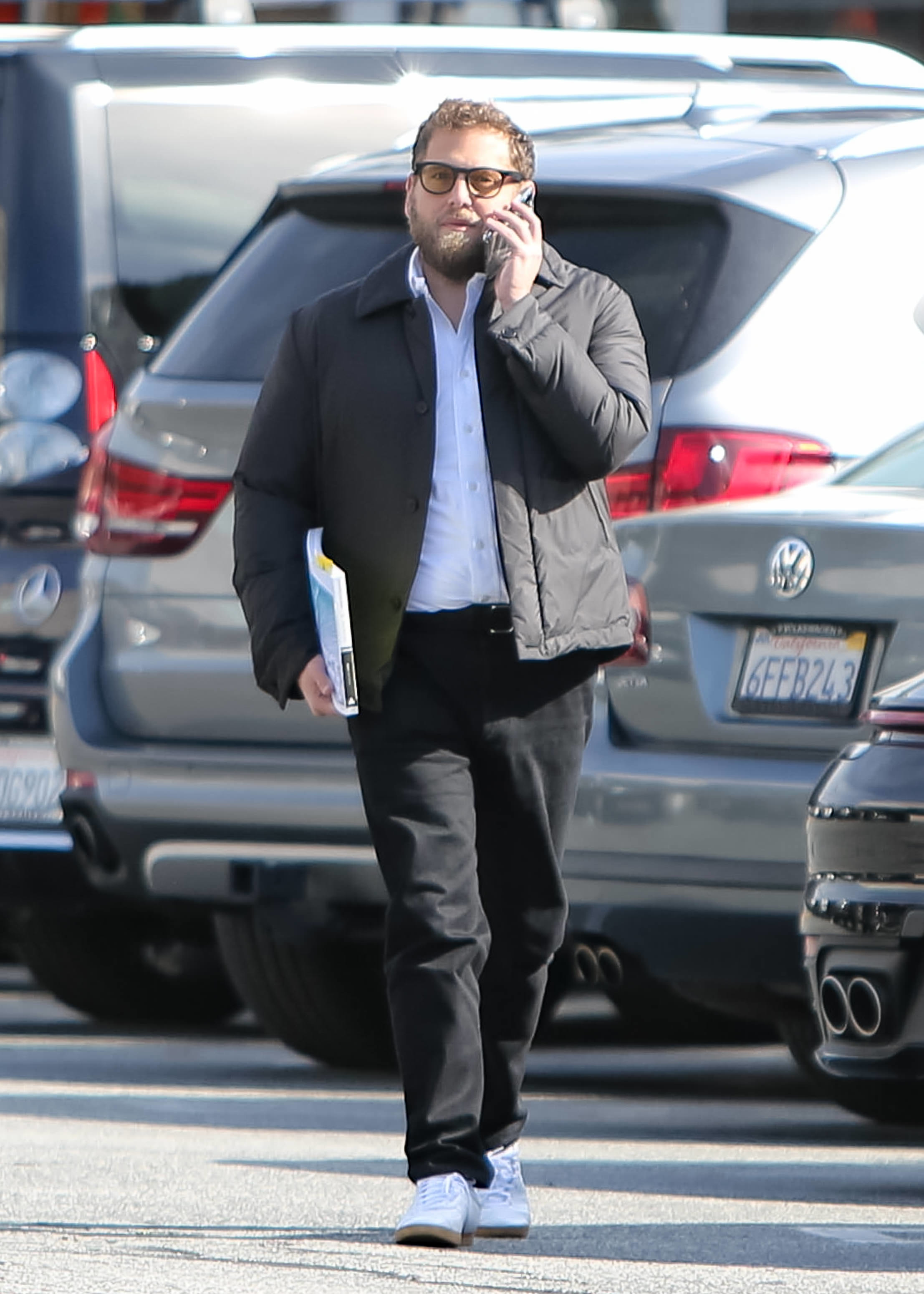 Close-up of Jonah on the phone outside