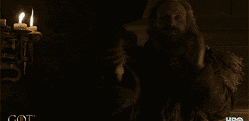gif of character from game of thrones clapping their hands in dark room