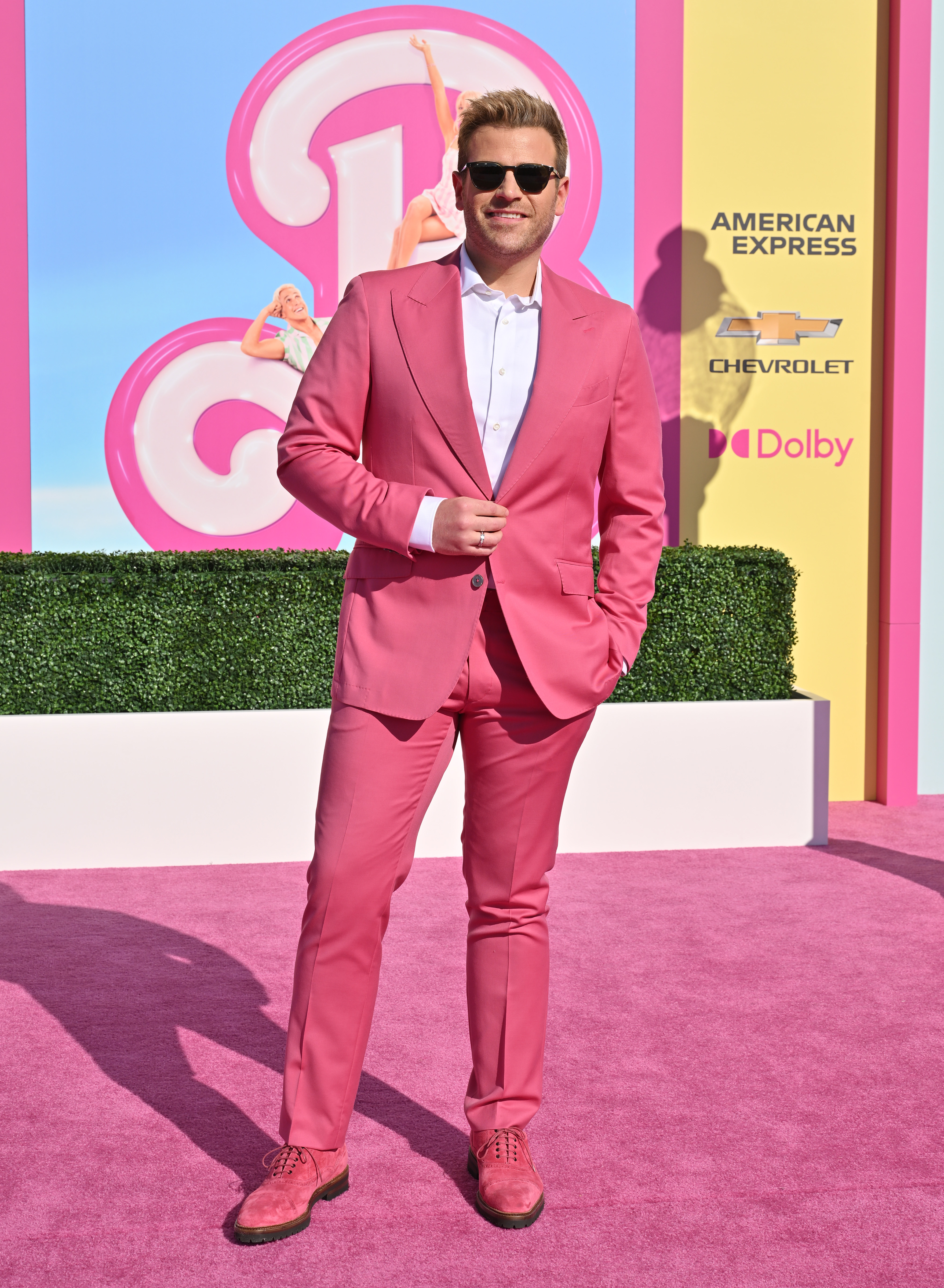In a pink suit