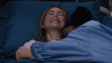Zola from Grey&#x27;s Anatomy hugging Meredith in a hospital bed