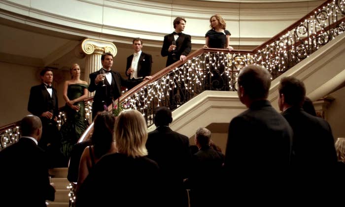 The Mikaelson family standing on a beautiful large staircase