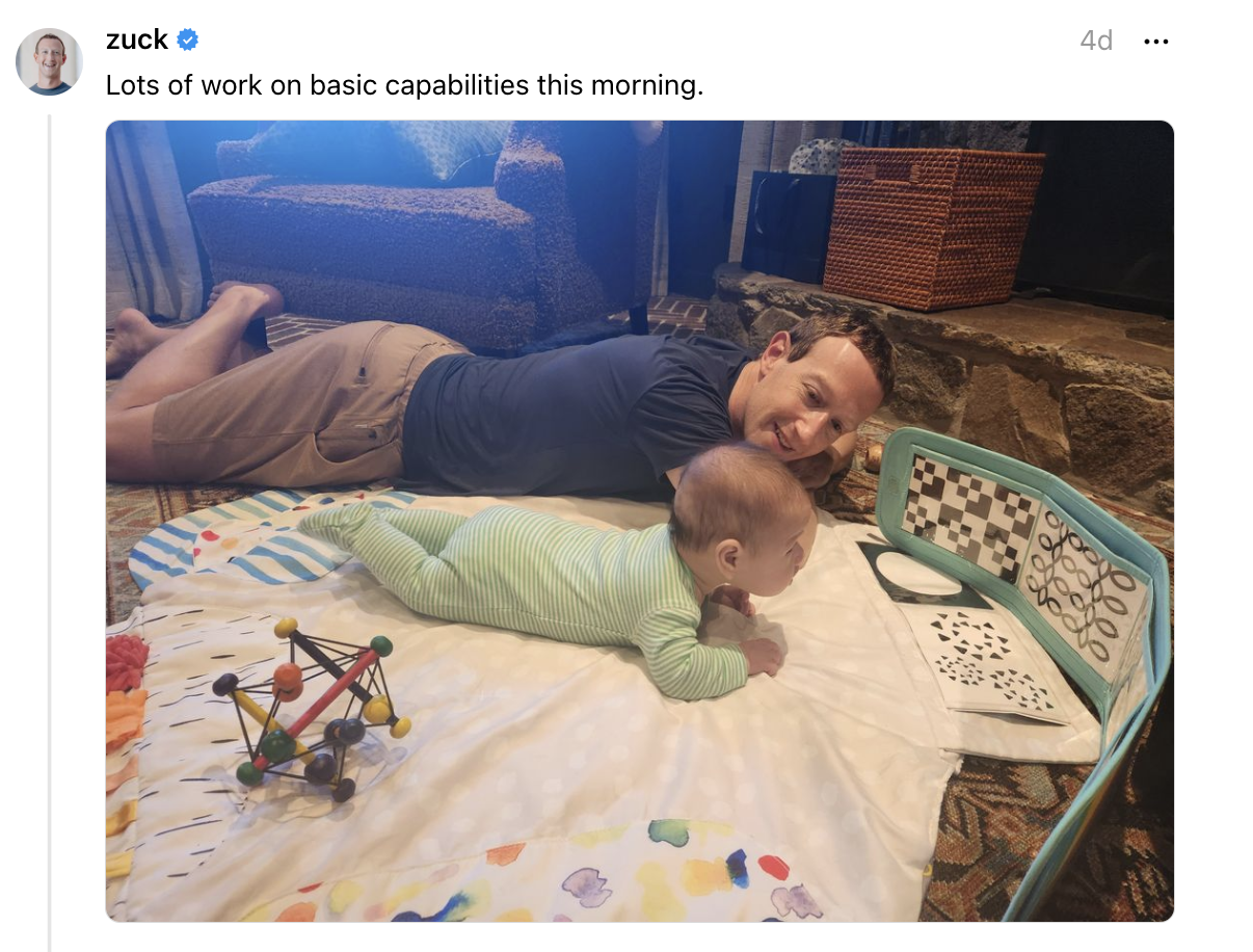 Mark Zuckerberg lying the ground with his baby