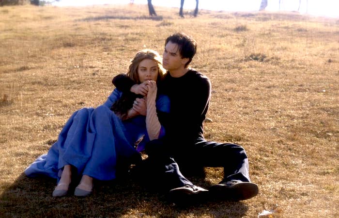 Damon and Rose sitting in a field