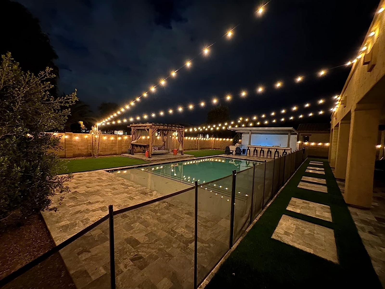 Reviewer&#x27;s backyard is illuminated by the string lights