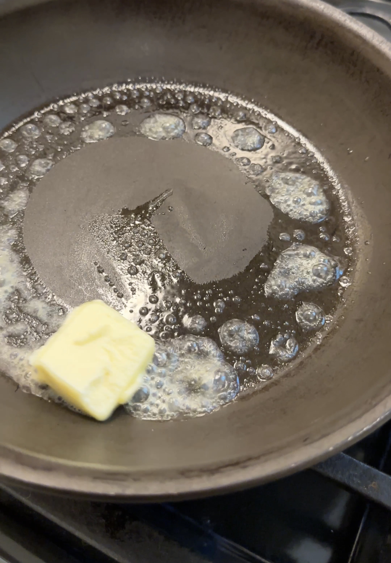 swirling butter around a hot skillet as it melts