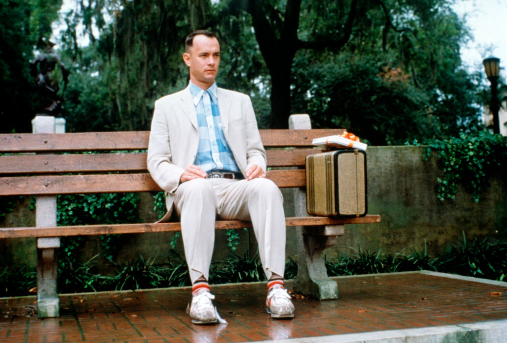 Tom as Forrest sitting on a bench
