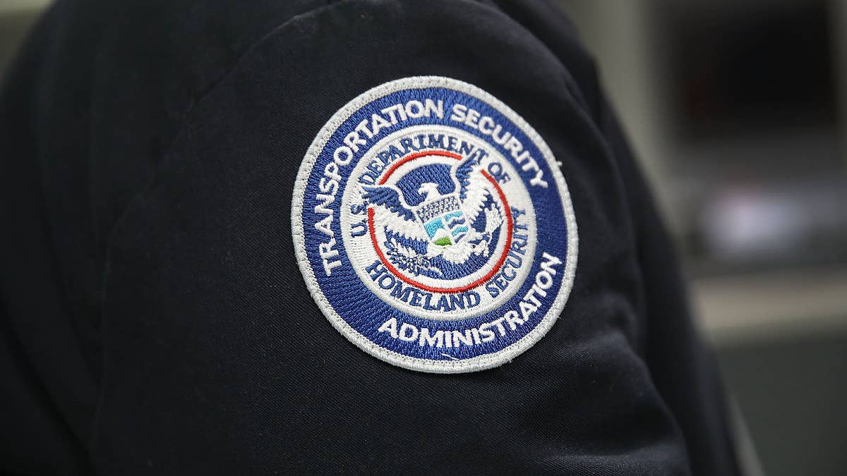 Officers at Miami International Airport were booked on charges of organized schemes to defraud.