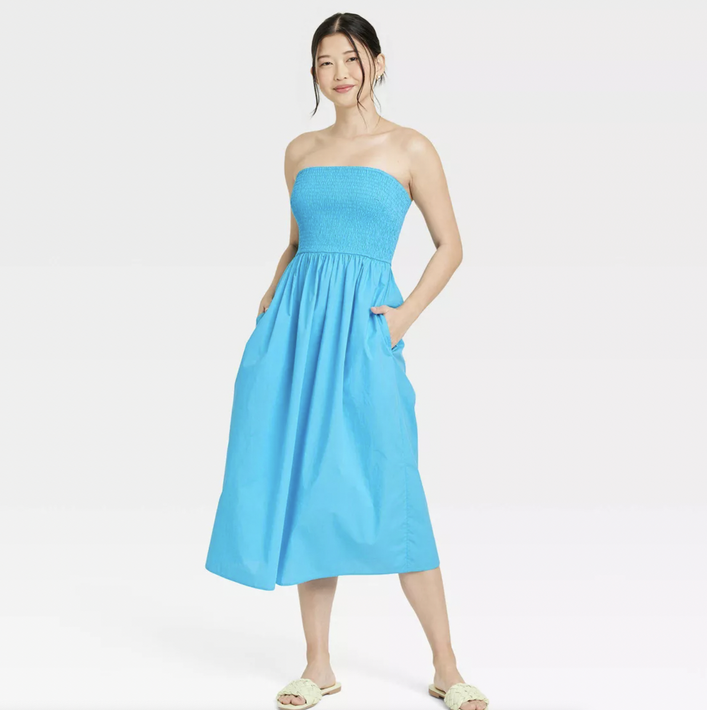 a model wearing the dress in blue